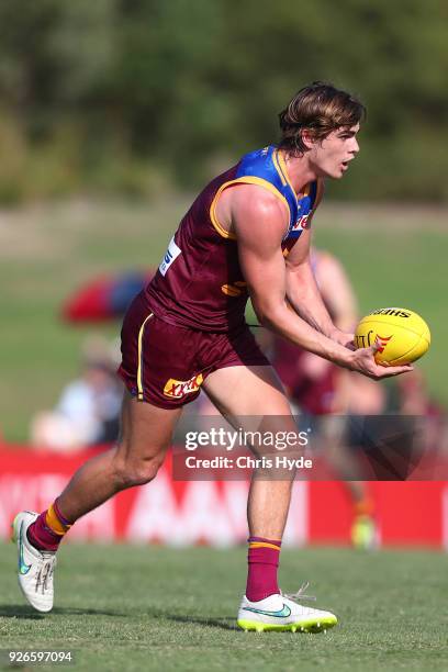 Ben Keays of the Lions handballs during the AFL JLT Community Series match between the Brisbane Lions and the Sydney Swans at Moreton Bay Central...