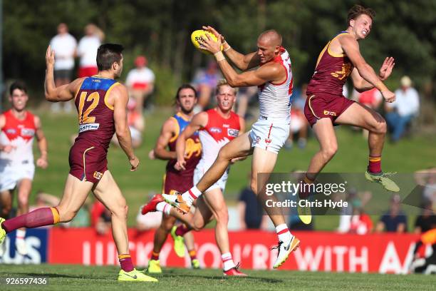 Sam Reid of the Swans takes a mark during the AFL JLT Community Series match between the Brisbane Lions and the Sydney Swans at Moreton Bay Central...