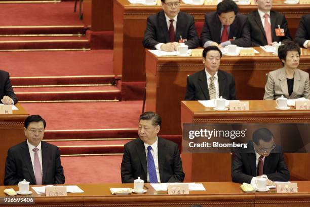 Zhang Dejiang, chairman of the Standing Committee of the National People's Congress, left, Xi Jinping, China's president, center, and Li Keqiang,...