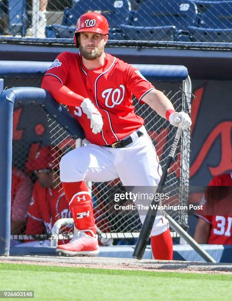 Washington Nationals outfielder Bryce Harper waits to step into the on deck circle during action against the Miami Marlins during spring training...