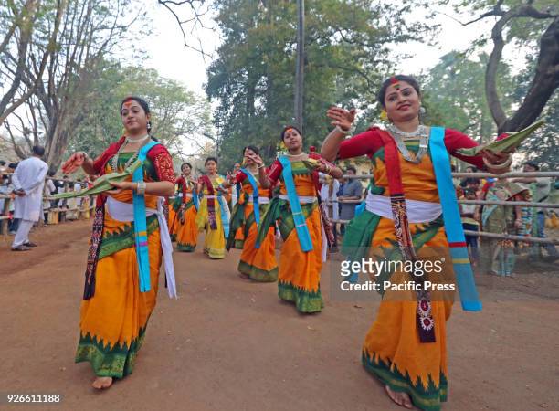 Students of Visva-Bharati University performing dance in a rhythm followed by singing in a procession to celebrate Basanta Utsav to mark 'Holi' ....