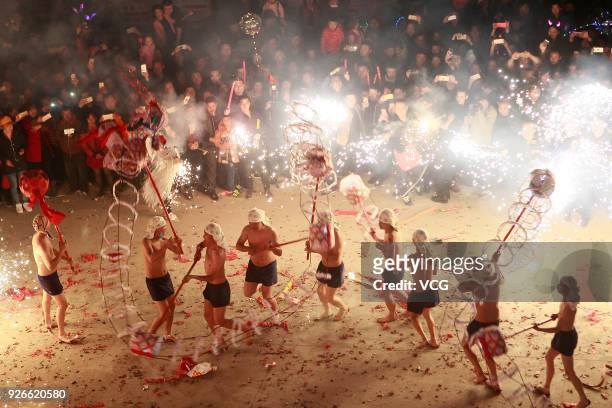 Villagers perform fire dragon dance to celebrate Lantern Festival at Santai County on March 2, 2018 in Mianyang, Sichuan Province of China. Chinese...