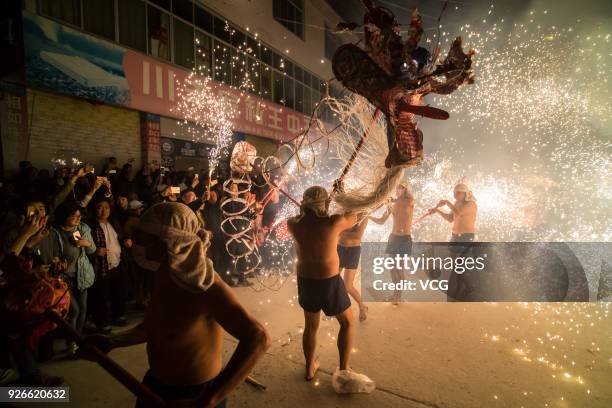 Villagers perform fire dragon dance to celebrate Lantern Festival at Santai County on March 2, 2018 in Mianyang, Sichuan Province of China. Chinese...