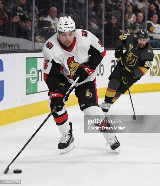 Cody Ceci of the Ottawa Senators skates with the puck ahead of Tomas Tatar of the Vegas Golden Knights in the second period of their game at T-Mobile...