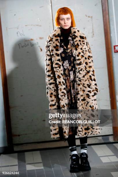 Model presents a creation by Junya Watanabe during the 2018/2019 fall/winter collection fashion show on March 3, 2018 in Paris.