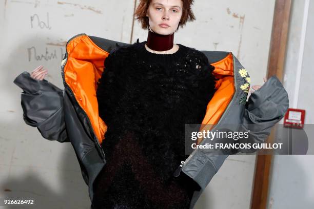 Model presents a creation by Junya Watanabe during the 2018/2019 fall/winter collection fashion show on March 3, 2018 in Paris.