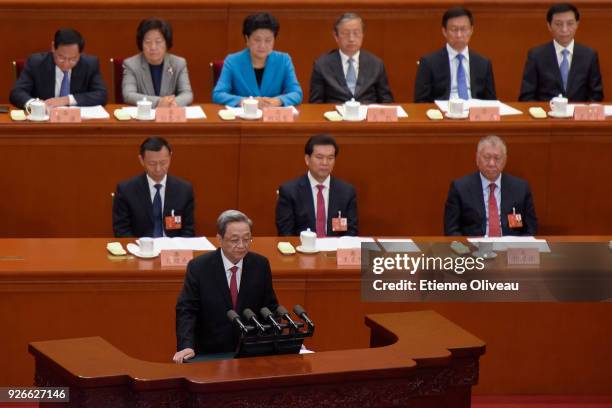 Chairman of the National Committee of the Chinese People's Political Consultative Conference Yu Zhengsheng, delivers his report during the opening...