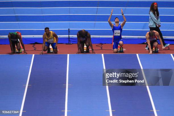 Hassan Taftian of Iran looks up during the 60 Metres Men Round 1 Heat 3 during the IAAF World Indoor Championships on Day Three at Arena Birmingham...
