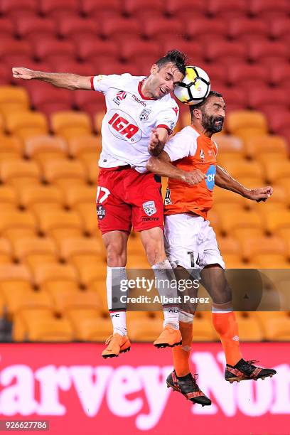 Nikola Mileusnic of Adelaide and Fahid Ben Khalfallah of the Roar challenge for the ball during the round 22 A-League match between the Brisbane Roar...