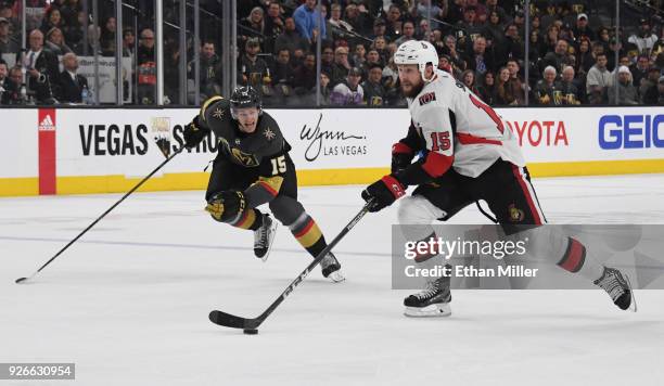 Zack Smith of the Ottawa Senators skates with the puck against Jon Merrill of the Vegas Golden Knights in the third period of their game at T-Mobile...