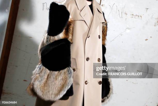 Model presents a creation by Junya Watanabe during the 2018/2019 fall/winter collection fashion show on March 3, 2018 in Paris.