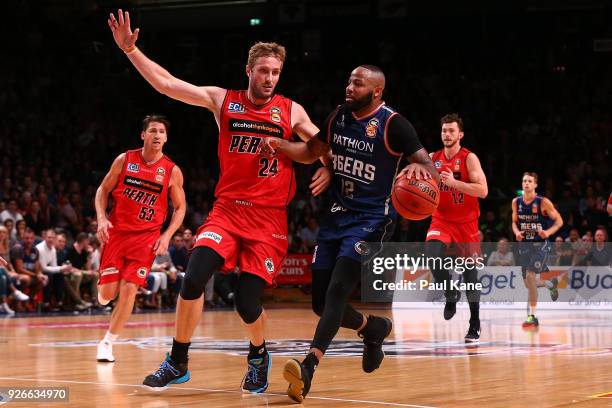 Shannon Shorter of the 36ers brings the ball up the court against Jesse Wagstaff of the Wildcats during game one of the Semi Final series between the...