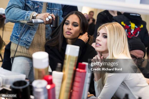 Cindy Bruna and Devon Windsor prepare backstage before the Redemption show as part of the Paris Fashion Week Womenswear Fall/Winter 2018/2019 on...