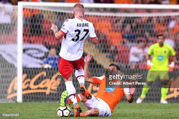 Jack Hingert of the Roar steals the ball from Daniel Adlung of Adelaide during the round 22 A-League match between the Brisbane Roar and Adelaide...