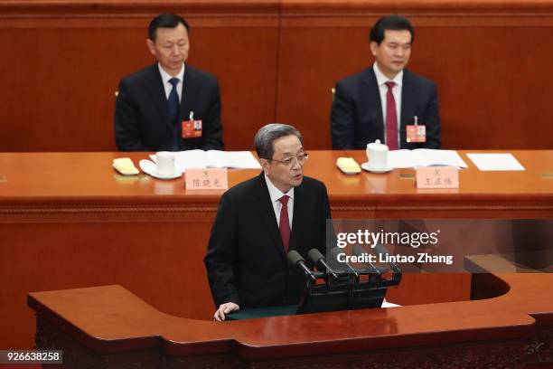 Yu Zhengsheng, chairman of the National Committee of the Chinese People's Political Consultative Conference delivers his report during the opening...