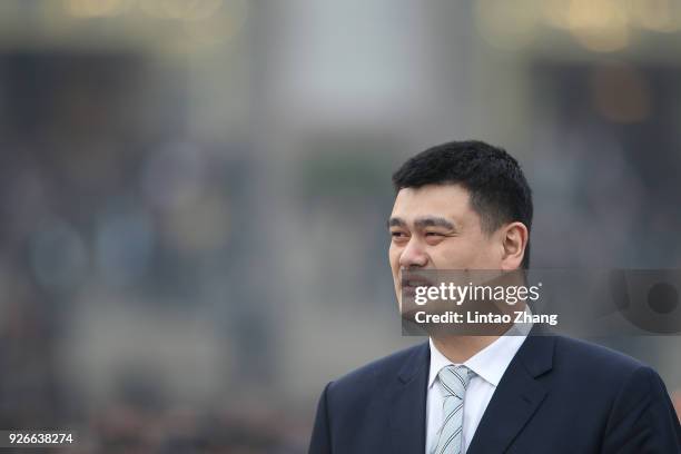 Former NBA star Yao Ming arrives at the Great Hall of the People to attend the opening ceremony of the Chinese People's Political Consultative...