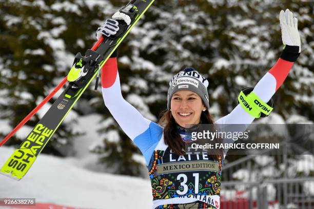 Third placed Wendy Holdener of Switzerland celebrates during the podium ceremony of the Women's Super-G at the FIS Alpine Ski World Cup on March 3,...