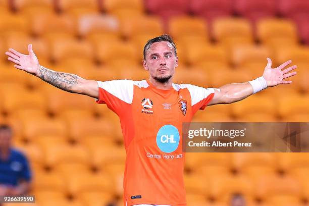 Eric Bautheac of the Roar celebrates with team mates after scoring a goal during the round 22 A-League match between the Brisbane Roar and Adelaide...