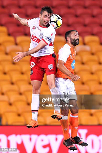 Nikola Mileusnic of Adelaide and Fahid Ben Khalfallah of the Roar challenge for the ball during the round 22 A-League match between the Brisbane Roar...