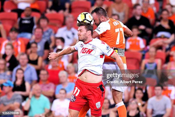 Johan Absalonsen of Adelaide and Ivan Franjic of the Roar vie for the ball during the round 22 A-League match between the Brisbane Roar and Adelaide...