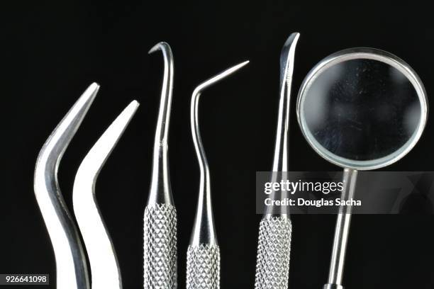 professional dentist cleaning and examining tools - dental explorer stockfoto's en -beelden