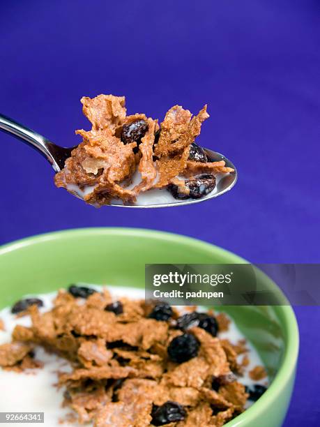bite of raisin bran cereal - raisin bran stock pictures, royalty-free photos & images
