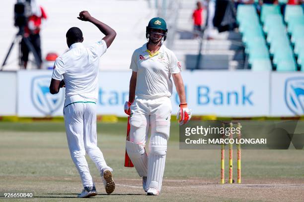 South African bowler Kagiso Rabada celebrates after taking the wicket of Australian batsman Mitchell Marsh during the third day of the first Test...