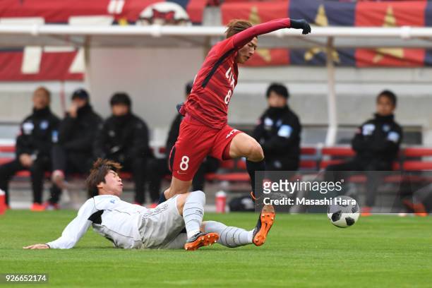 Shoma Doi of Kashima Antlers and Genta Miura of Gamba Osaka compete for the ball during the J.League J1 match between Kashima Antlers and Gamba Osaka...