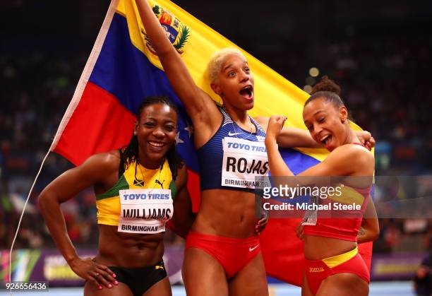 Gold Medallist, Yulimar Rojas of Venezuela, Silver Medallist, Kimberly Williams of Jamaica and Bronze Medallist, Ana Peleteiro of Spain celebrate...