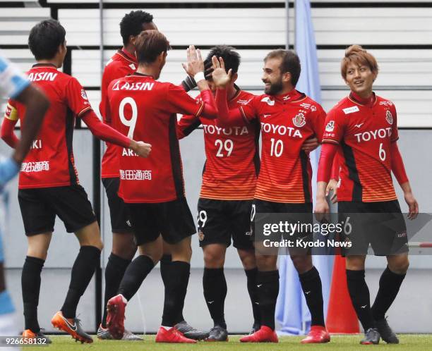 Gabriel Xavier celebrates with Nagoya Grampus teammates after scoring in the first half of a 1-0 win over Jubilo Iwata in the J-League first division...