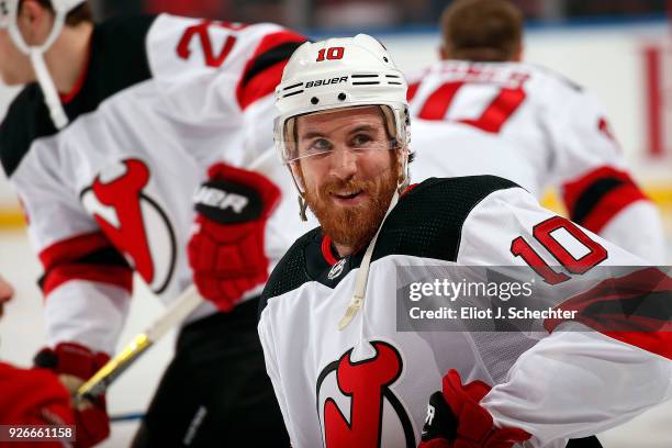 Jimmy Hayes of the New Jersey Devils stretches on the ice prior to the start of the game against the Florida Panthers at the BB&T Center on March 1,...