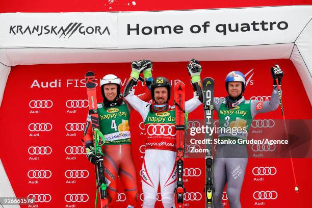 Henrik Kristoffersen of Norway takes 2nd place, Marcel Hirscher of Austria takes 1st place, Alexis Pinturault of France takes 3rd place during the...