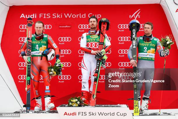 Henrik Kristoffersen of Norway takes 2nd place, Marcel Hirscher of Austria takes 1st place, Alexis Pinturault of France takes 3rd place during the...