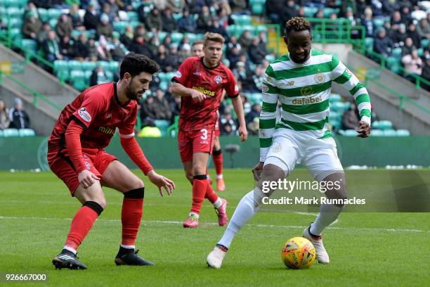 Moussa Dembele of Celtic is challenged by Thomas O'Ware of Greenock Morton during the Scottish Cup Quarter Final match between Celtic and Greenock...