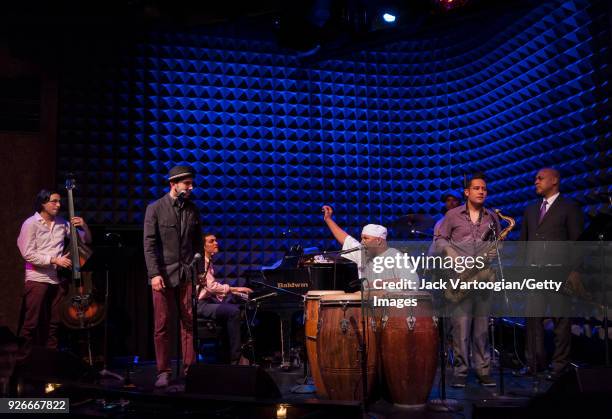 Cuban-born Latin musician Joaquin Pozo plays congas as he performs with his band at Joe's Pub nightclub, New York, New York, October 28, 2013....