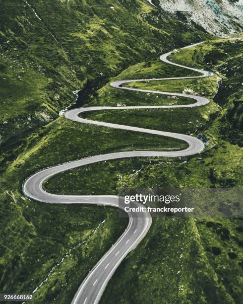 julier pass road in switzerland - road stock pictures, royalty-free photos & images