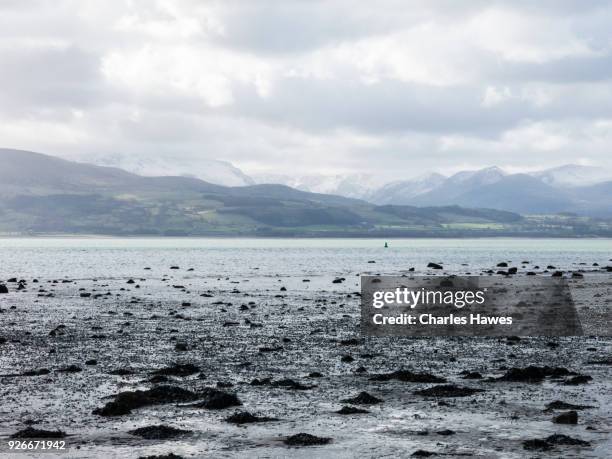 fryers bay near beaumaris and view across the menai strait.  the wales coast path on the south and east coast of anglesey - menai straits stock pictures, royalty-free photos & images