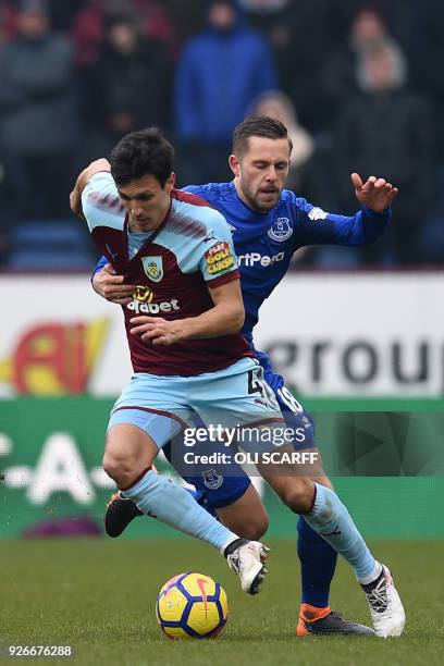 Burnley's English midfielder Jack Cork vies with Everton's Icelandic midfielder Gylfi Sigurdsson during the English Premier League football match...