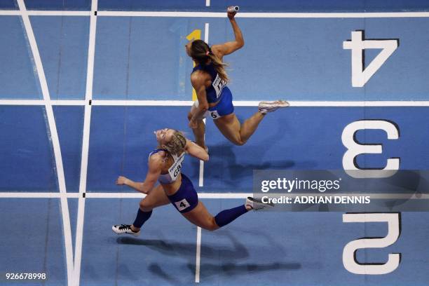 Britain's Meghan Beesley takes second ahead of Italy's Maria Enrica Spacca in the women's 4x400m relay round 1 heats at the 2018 IAAF World Indoor...