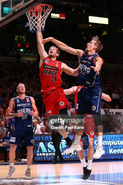 Jesse Wagstaff of the Wildcats looks to block a shot by Anthony Drmic of the 36ers during game one of the Semi Final series between the Adelaide...