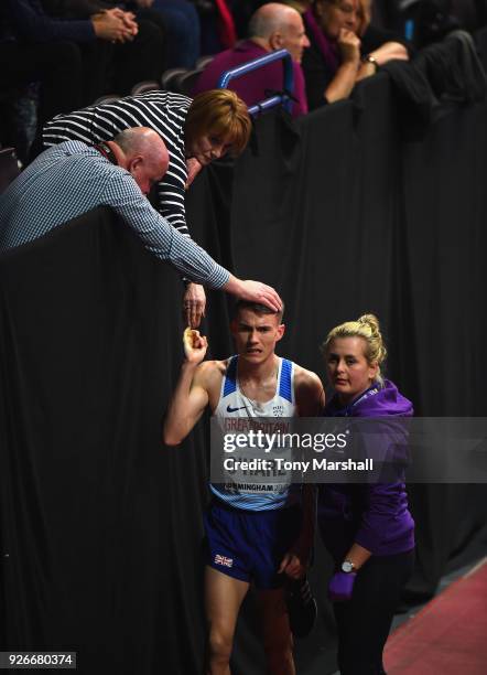 Chris O'Hare of Great Britain is commiserated with after finishing fifth in his heat of the Men's 1500m during Day Three of the IAAF World Indoor...