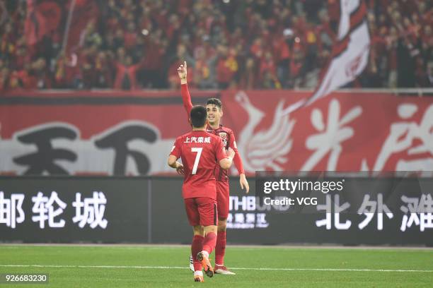 Oscar of Shanghai SIPG celebrates a point with Wu Lei of Shanghai SIPG during the 2018 Chinese Football Association Super League first round match...