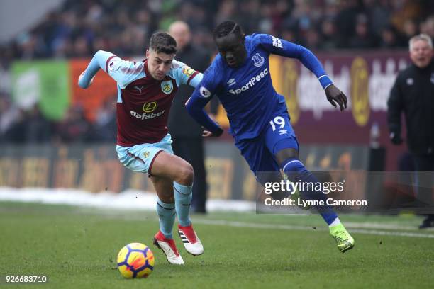 Oumar Niasse of Everton is challenged by Matthew Lowton of Burnley during the Premier League match between Burnley and Everton at Turf Moor on March...