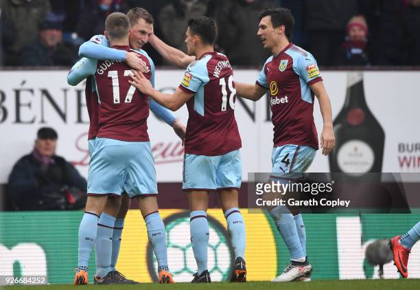 Chris Wood of Burnley celebrates with teammates after scoring his sides second goal during the Premier League match between Burnley and Everton at...