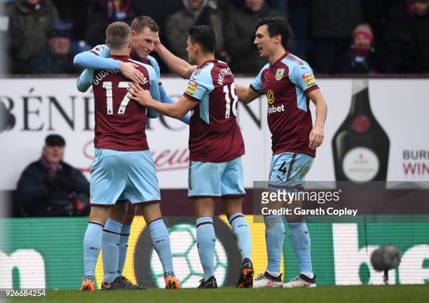 Chris Wood of Burnley celebrates with teammates after scoring his sides second goal during the Premier League match between Burnley and Everton at...