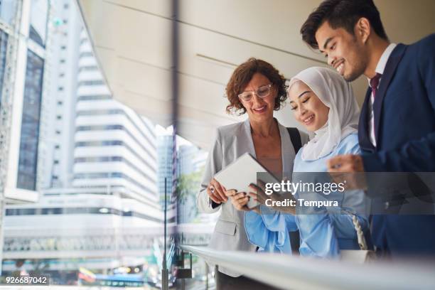 business meeting in kuala lumpur. - islam business stock pictures, royalty-free photos & images