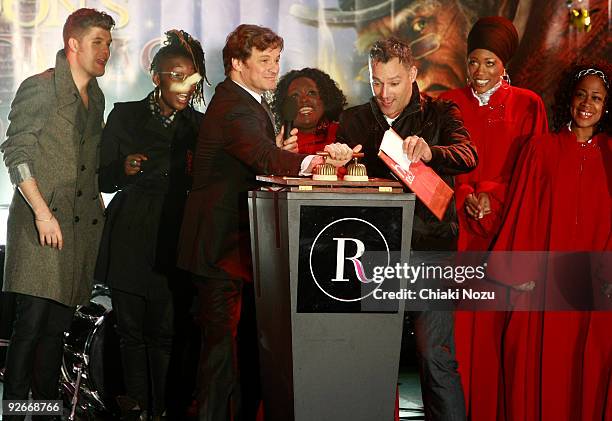 Daniel Merriweather, Colin Firth, Toby Anstis and London Community Gospel Choir members attend the annual switch on of Regent Street Christmas Lights...