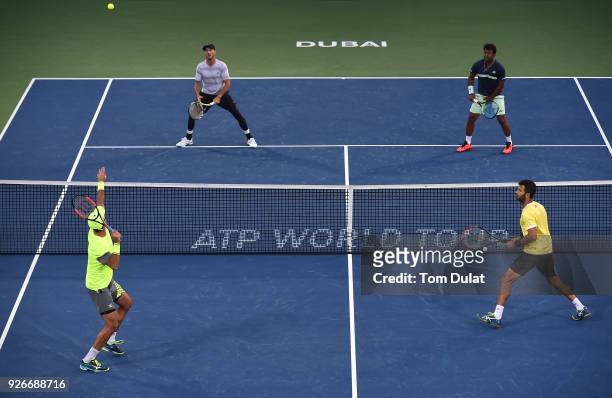 Jean-Julien Rojer of Netherlands and Horia Tecau of Romania in action their doubles final match against Jamie Cerretani of United States and Leander...