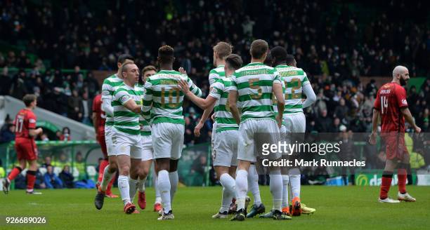 Moussa Dembele of Celtic celebrates scoring his first goal of the game with his team mates during the Scottish Cup Quarter Final match between Celtic...