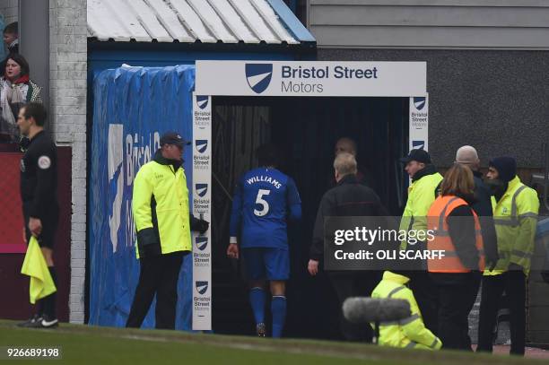 Everton's English-born Welsh defender Ashley Williams walks down the tunnel after being sent off after a clash with Burnley's English striker Ashley...